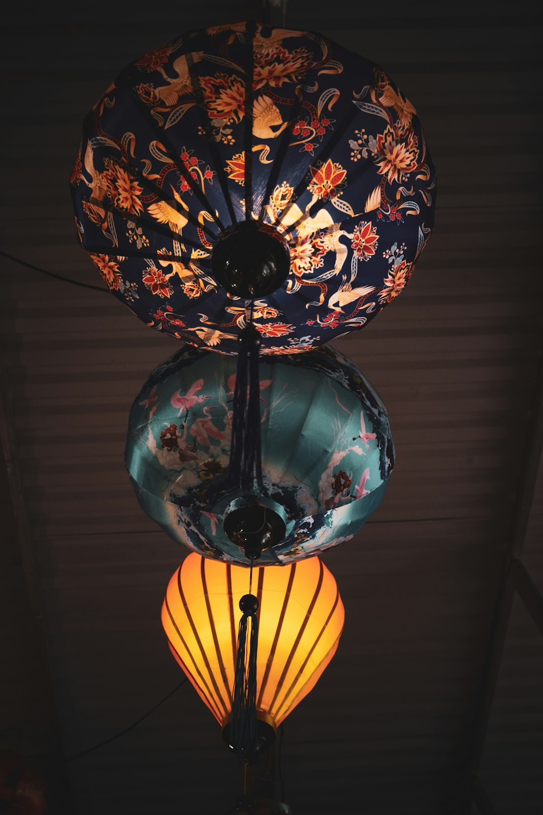 Local artisan teaching silk stretching technique for traditional Hoi An lantern